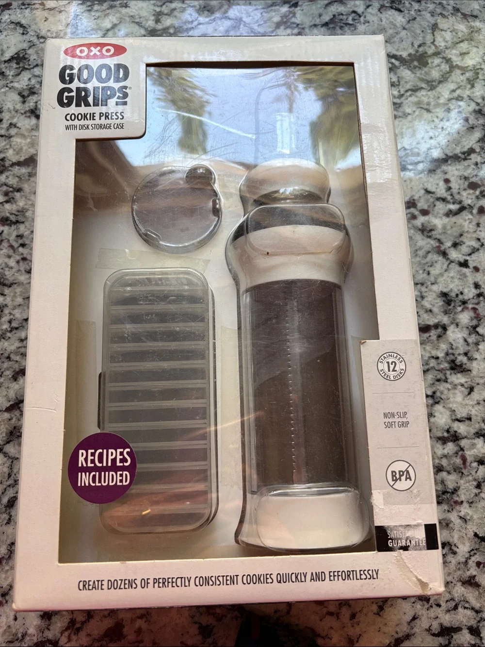 Oxo Good Grips Cookie Press with recipes and 12 discs. Used one time.